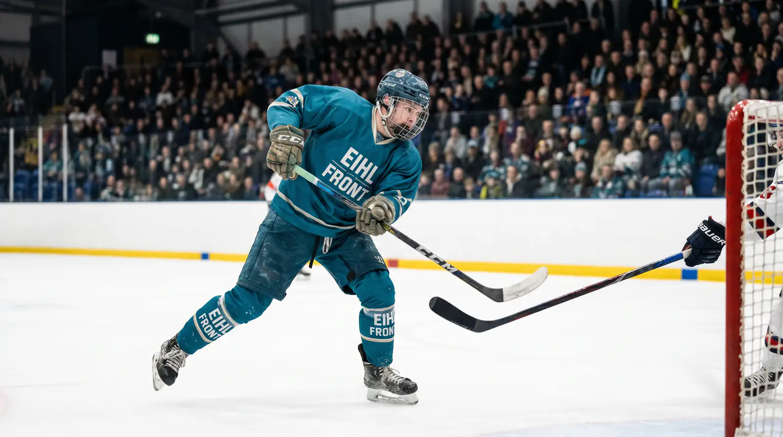 EIHL Belfast top-line forward winding up for a shot during a home regular-season match