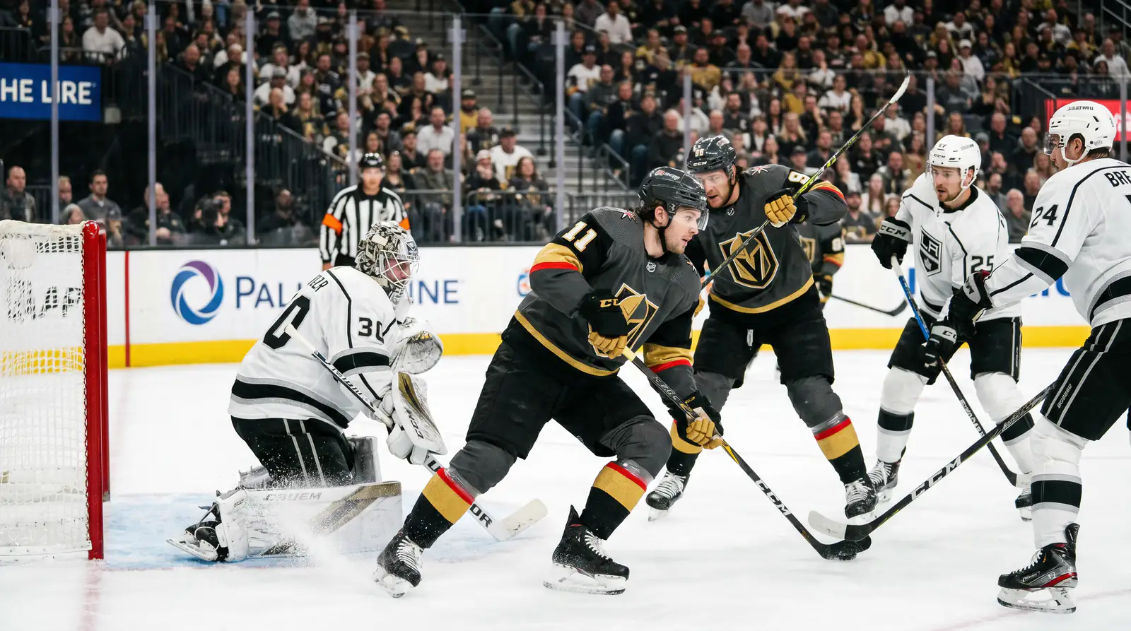 NHL forward screening the goalie during a power play opportunity